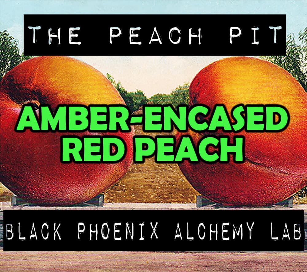 Amber-encased Red Peach Hair Gloss Perfume Bottle